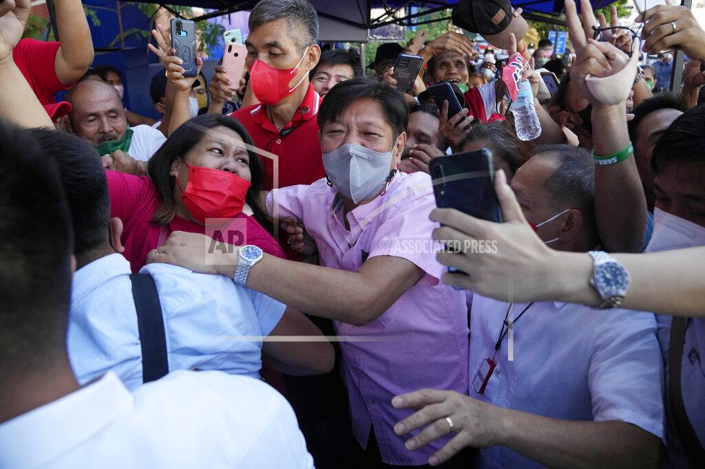 Aaron Favila Presidential candidate Ferdinand "Bongbong" Marcos Jr. greets the crowd as he celebrates outside his headquarters in Mandaluyong, Philippines on Wednesday, May 11, 2022. Marcos' apparent landslide victory in the Philippine presidential election is raising immediate concerns about a further erosion of democracy in Asia and could complicate American efforts to blunt growing Chinese influence and power in the Pacific. (AP Photo/Aaron Favila)