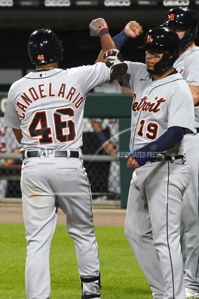 Nam Y. Huh Detroit Tigers' Jeimer Candelario, left, celebrates with Isaac Paredes after hitting a three-run home run during the fifth inning of a baseball game against the Chicago White Sox in Chicago, Wednesday, Aug. 19, 2020. (AP Photo/Nam Y. Huh)
