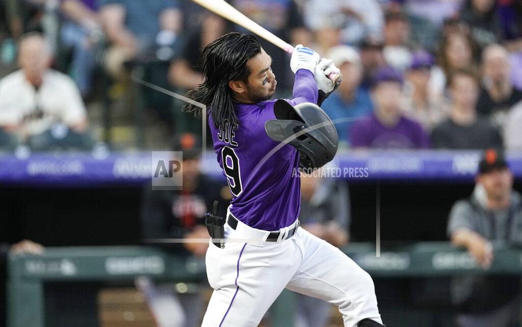 David Zalubowski Colorado Rockies' Connor Joe loses his batting helmet while swinging at a pitch from San Francisco Giants starting pitcher Alex Cobb in the third inning of a baseball game Tuesday, May 17, 2022, in Denver. (AP Photo/David Zalubowski)