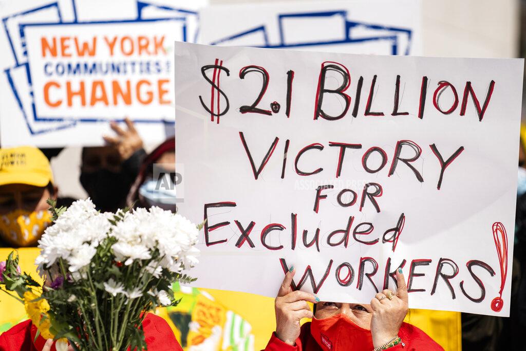 John Minchillo Demonstrators gather to declare victory and celebrate the passage of the New York state budget with the ending their hunger strike that lasted 23 days, Wednesday, April 7, 2021, in the Manhattan borough of New York. New Yorkers, regardless of immigration status, could apply for help from a new $2.4 billion rental relief program that will offer 12 months of overdue rent and utilities, three prospective months of rent and a year of eviction protection. (AP Photo/John Minchillo)
