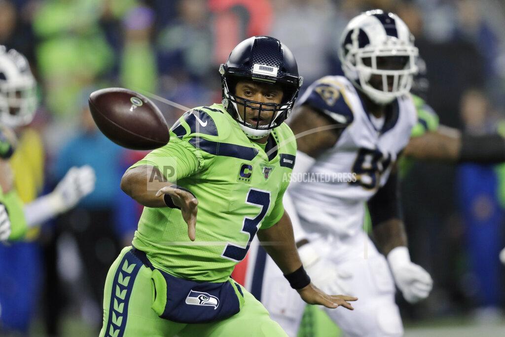 Stephen Brashear Seattle Seahawks quarterback Russell Wilson (3) pitches out to tight end Will Dissly during the second half of the team's NFL football game against the Los Angeles Rams on Thursday, Oct. 3, 2019, in Seattle. (AP Photo/Stephen Brashear)