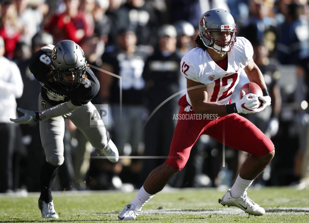 David Zalubowski Washington State wide receiver Dezmon Patmon, right, slips past Colorado defensive back Aaron Maddox for a short gain after pulling in a pass in the first half of an NCAA college football game Saturday, Nov. 10, 2018, in Boulder, Colo. (AP Photo/David Zalubowski)