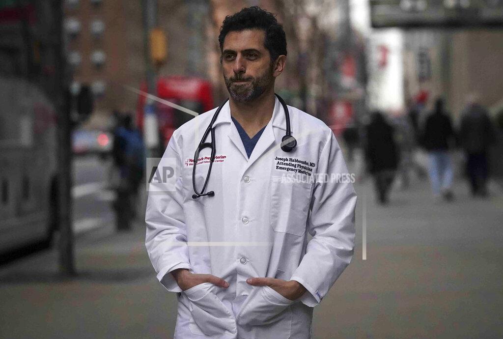 Bebeto Matthews Emergency room Dr. Joseph Habboushe pauses during an interview Friday, Feb. 26, 2021, in New York. At the peak of the pandemic last spring, Habboushe’s qualms were matched by a battlefield-like focus and the belief he could contribute to the fight. For him and many other health care workers, it was only after the first surge subsided that its mental impact really sank in. (AP Photo/Bebeto Matthews)