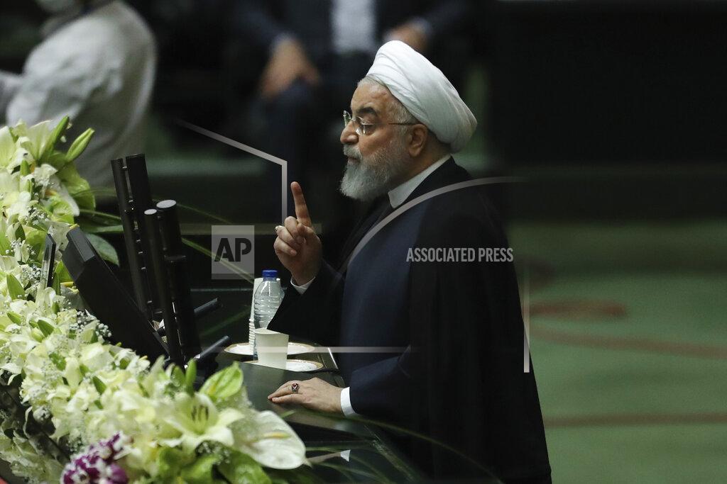 Vahid Salemi Iranian President Hassan Rouhani speaks during the inauguration of the new parliament in Tehran, Iran, Wednesday, May, 27, 2020. Iran has convened its newly elected parliament, dominated by conservative lawmakers and under strict social distancing regulations, as the country struggles to curb the spread of coronavirus that has hit the nation hard. Iran is grappling with one of the deadliest outbreaks in the Middle East. (AP Photo/Vahid Salemi)