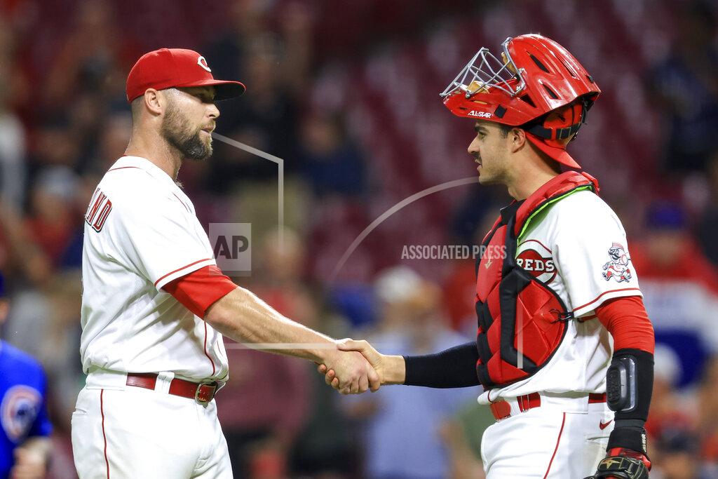 Aaron Doster Cincinnati Reds' Hunter Strickland, left, shakes hands with Aramis Garcia after the final out of the team's baseball game against the Chicago Cubs in Cincinnati, Wednesday, May 25, 2022. The Reds won 4-3. (AP Photo/Aaron Doster)