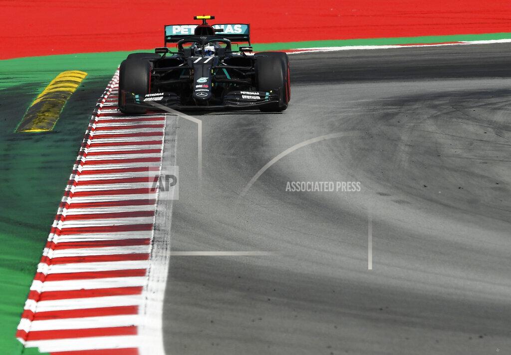 Josep Lago Mercedes driver Valtteri Bottas of Finland steers his car during the Formula One Grand Prix at the Barcelona Catalunya racetrack in Montmelo, Spain, Sunday, Aug. 16, 2020. (Josep Lago, Pool via AP)