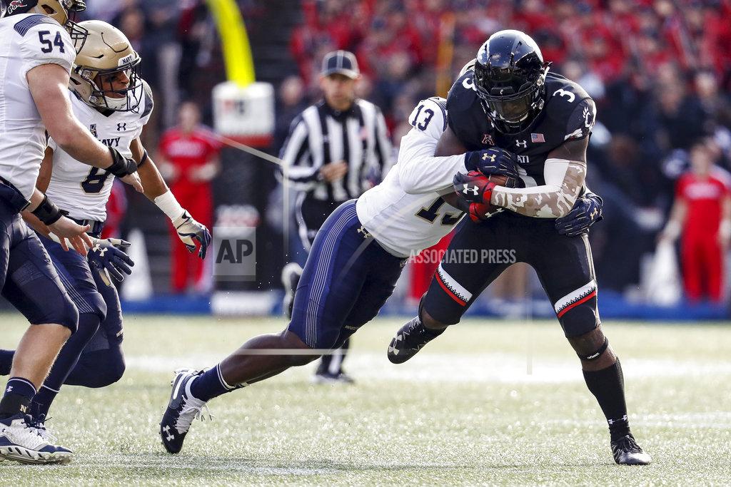 John Minchillo Cincinnati running back Michael Warren II (3) is tackled by Navy safety Juan Hailey (13) in the first half of an NCAA college football game, Saturday, Nov. 3, 2018, in Cincinnati. (AP Photo/John Minchillo)
