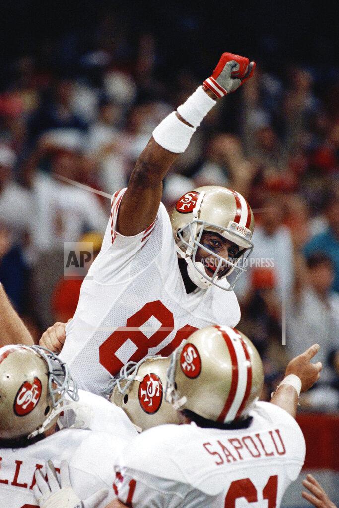 John Gapps Iii FILE - In this Jan. 28, 1990, file photo, San Francisco 49ers wide receiver Jerry Rice raises his fist in jubilation as he celebrates with teammates Bruce Collie, Left, and Jesse Sapolu after scoring his second touchdown of the day with 34 seconds left in the second quarter at Super Bowl XXIV in New Orleans. The San 49ers ruled most of the 1980s by winning Super Bowls after the 1981, '84, '88 and '89 seasons. (AP Photo/John Gapps III, File)