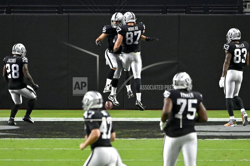 David Becker Las Vegas Raiders tight end Foster Moreau (87) celebrates after Las Vegas Raiders fullback Alec Ingold, left, scored a touchdown against the New Orleans Saints during the first half of an NFL football game, Monday, Sept. 21, 2020, in Las Vegas. (AP Photo/David Becker)