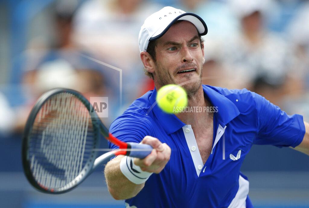 Gary Landers FILE - In this Monday, Aug. 12, 2019 file photo Andy Murray, of Britain, hits a forehand against Richard Gasquet, of France, during first-round play at the Western & Southern Open tennis tournament, in Mason, Ohio. Former world number one Murray's participation at the upcoming Australian Open is in doubt after the Briton tested positive for COVID-19. (AP Photo/Gary Landers, File)
