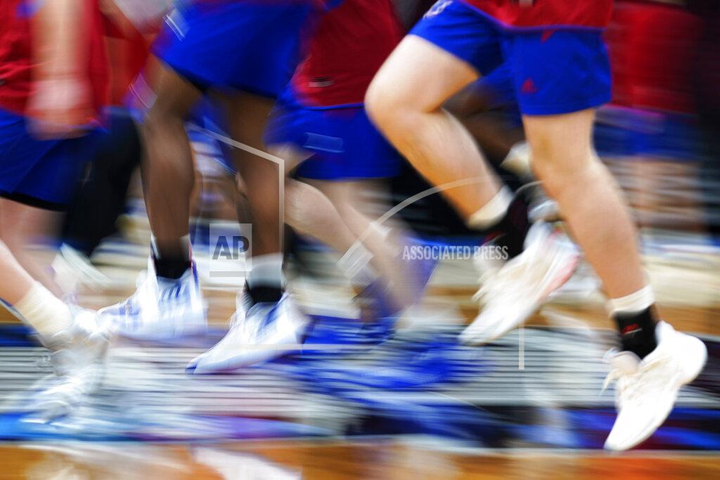 Nam Y. Huh Kansas players run on the court during a practice for the NCAA men's college basketball tournament Thursday, March 24, 2022, in Chicago. Kansas faces Providence in a Sweet 16 games on Friday.(AP Photo/Nam Y. Huh)
