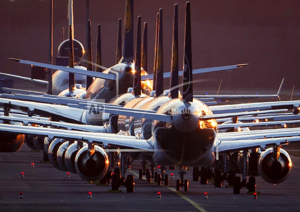 Michael Probst FILE - In this March 15, 2020 file photo, Lufthansa aircraft are parked on a runway at the airport in Frankfurt, Germany. Due to the Coronavirus Lufthansa had to cancel half of its flights. More than 50,000 people have died after contracting COVID-19 in Germany, a number that has risen swiftly over recent weeks as the country has struggled to bring down infection figures. (AP Photo/Michael Probst, File)