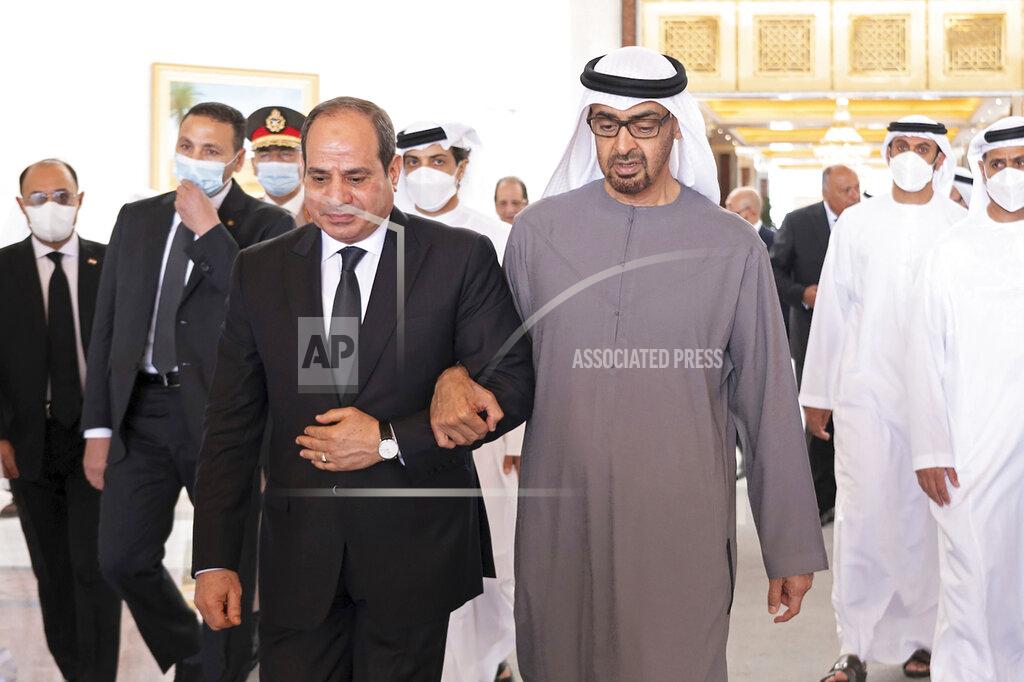 Mohamed Al Hammadi This photo provided by the Ministry of Presidential Affairs, shows Egyptian President Abdel Fattah El Sisi, center left, walking with Sheikh Mohamed bin Zayed Al Nahyan, the new President of the United Arab Emirates, on his arrival to offer offers condolences on the death of Sheikh Khalifa bin Zayed Al Nahyan, the late President of the UAE, at the Presidential Airport in Abu Dhabi, UAE, Saturday, May 14, 2022. An array of presidents and prime ministers continued to descend on the UAE Sunday from around the world to pay their respects to the federation's late ruler and greet his successor — a vivid sign of Abu Dhabi's influence in Western and Arab capitals. (Mohamed Al Hammadi/Ministry of Presidential Affairs via AP)