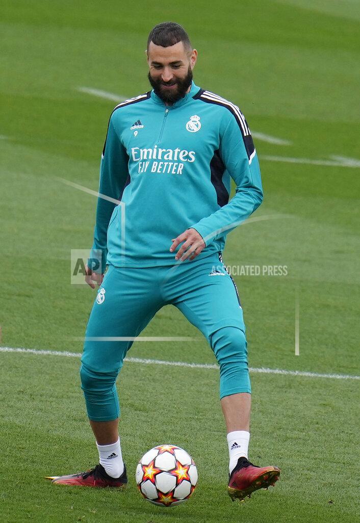 Manu Fernandez Real Madrid's Karim Benzema kicks a ball during a Media Opening day training session in Madrid, Spain, Tuesday, May 24, 2022. Real Madrid will play Liverpool in Saturday's Champions League soccer final in Paris. (AP Photo/Manu Fernandez)