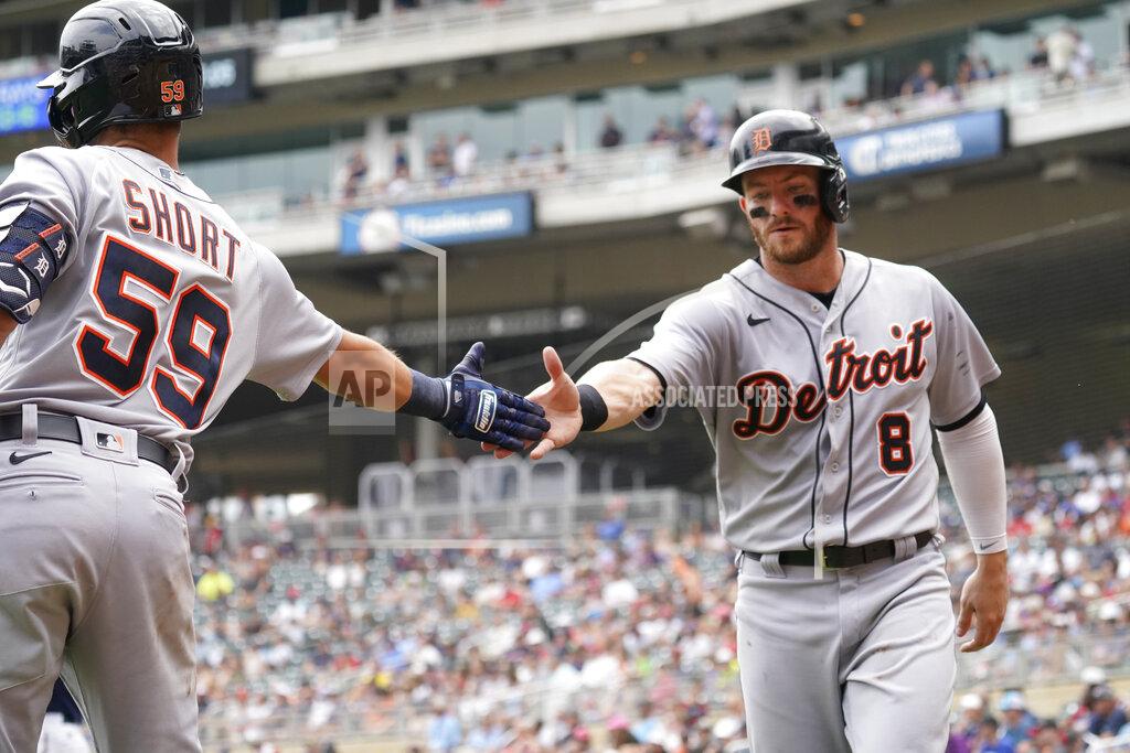 Jim Mone Detroit Tigers' Robbie Grossman (8) is greeted by Zack Short after Grossman scored on a two-run double by Jeimer Candelario off Minnesota Twins pitcher J.A. Happ in the fourth inning of a baseball game, Wednesday, July 28, 2021, in Minneapolis. (AP Photo/Jim Mone)