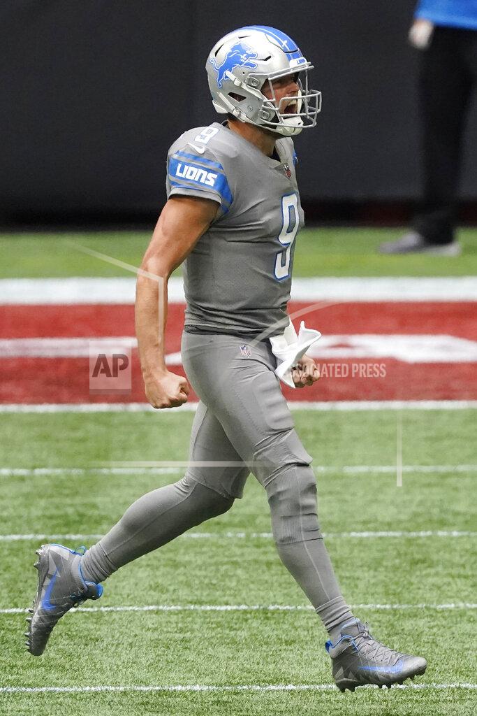 John Bazemore Detroit Lions quarterback Matthew Stafford (9) celebrates victory during the second half of an NFL football game against the Atlanta Falcons, Sunday, Oct. 25, 2020, in Atlanta. The Detroit Lions won 23-22. (AP Photo/John Bazemore)