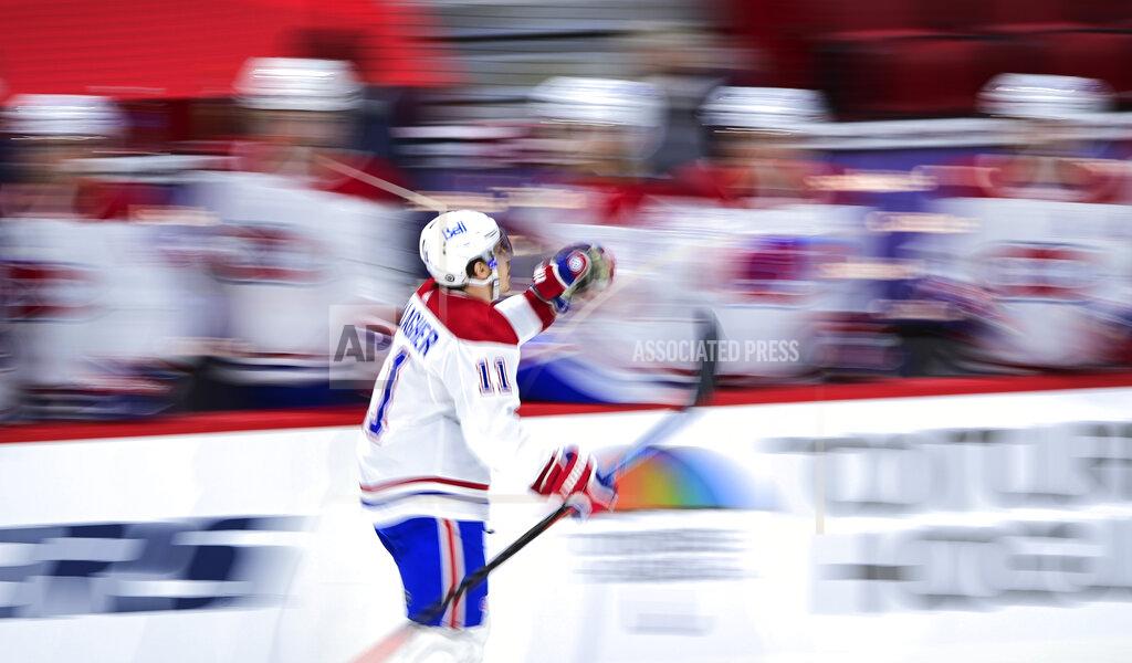 Sean Kilpatrick Montreal Canadiens' Brendan Gallagher (11) celebrates a goal against the Ottawa Senators as he skates past the bench during the third period of an NHL hockey game Thursday, April 1, 2021, in Ottawa, Ontario. (Sean Kilpatrick/The Canadian Press via AP)