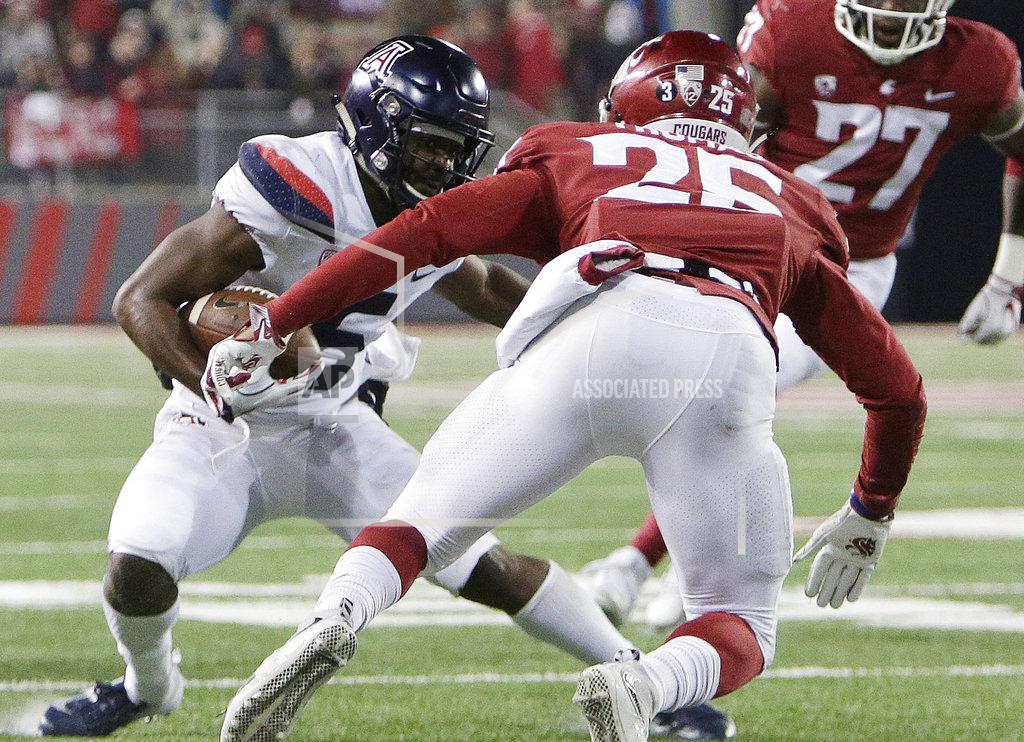 Young Kwak Arizona wide receiver Shun Brown, left, runs with the ball while under pressure from Washington State safety Skyler Thomas during the second half of an NCAA college football game in Pullman, Wash., Saturday, Nov. 17, 2018. Washington State won 69-28. (AP Photo/Young Kwak)