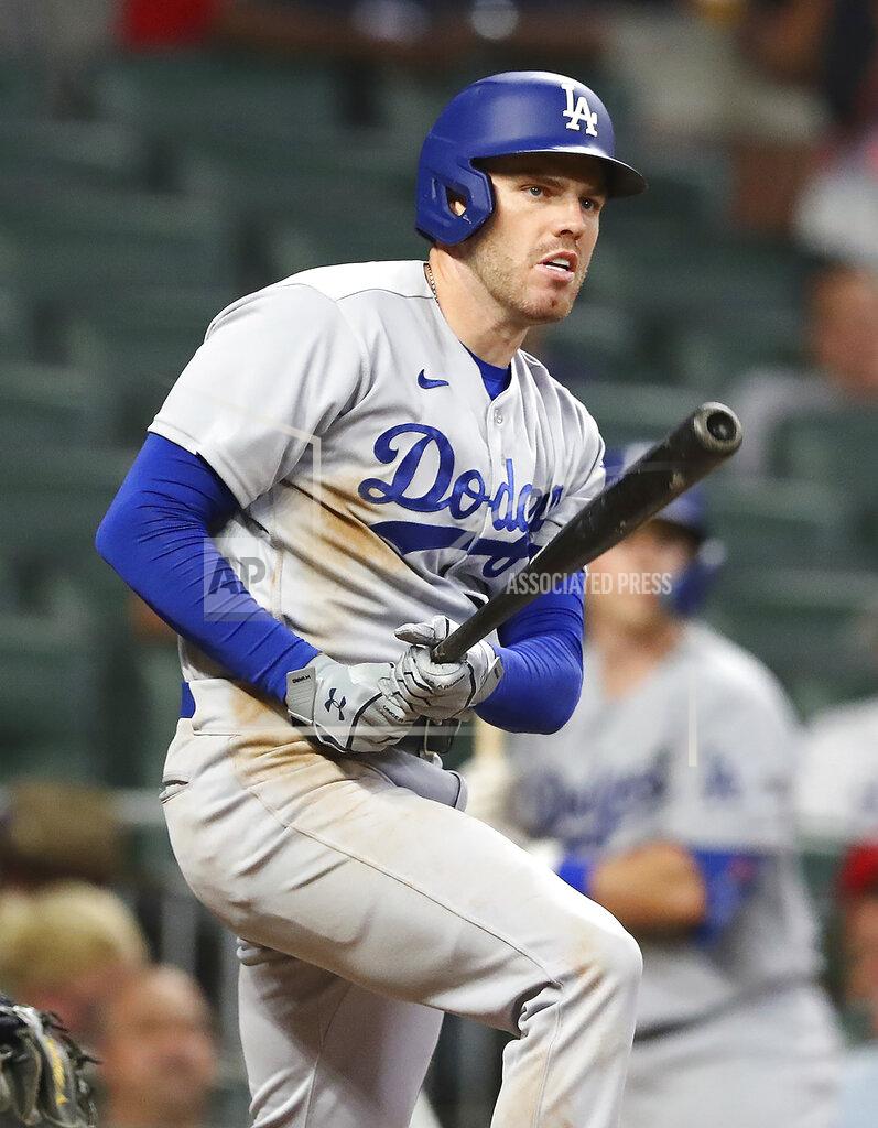 Curtis Compton Los Angles Dodgers first baseman Freddie Freeman hits an RBI double to take a 3-2 lead over the Atlanta Braves during the 10th inning in a baseball game on Sunday, June 26, 2022, in Atlanta. Freeman helped lead the Dodgers to a 5-3 victory over the Braves in eleven innings. (Curtis Compton/Atlanta Journal-Constitution via AP)