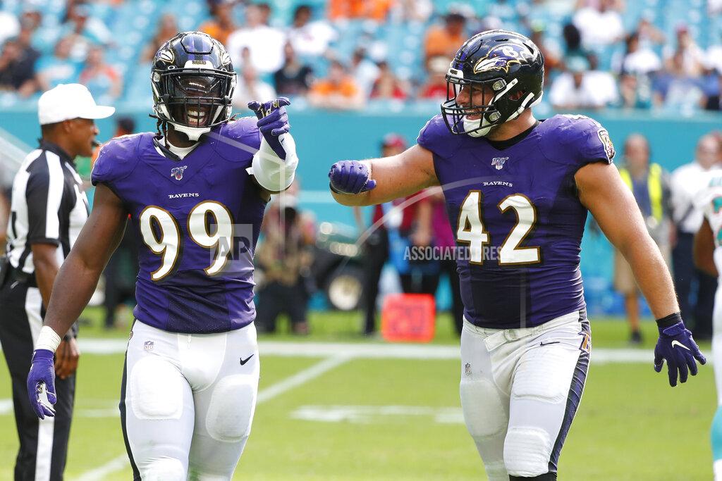 Wilfredo Lee Baltimore Ravens outside linebacker Matt Judon (99) gestures to the team after sacking Miami Dolphins quarterback Josh Rosen, during the second half at an NFL football game, Sunday, Sept. 8, 2019, in Miami Gardens, Fla. To the right is Baltimore Ravens fullback Patrick Ricard (42). The Ravens defeated the Dolphins 59-10.(AP Photo/Wilfredo Lee)