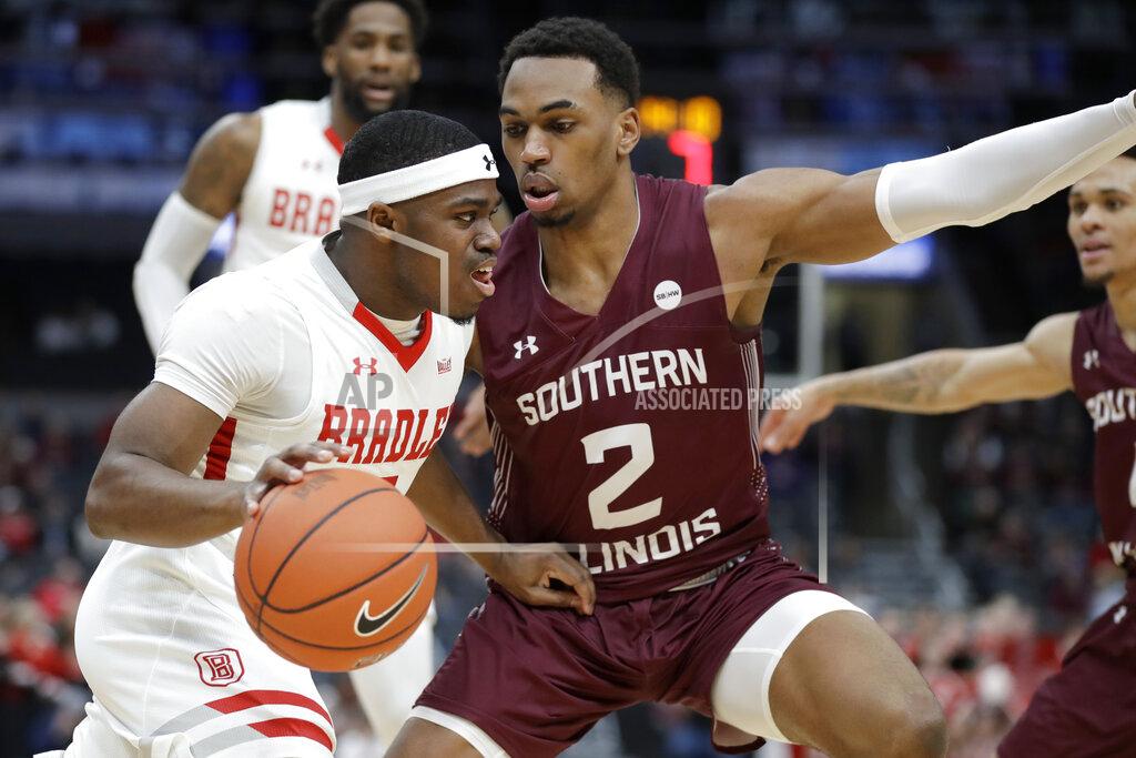 Jeff Roberson Bradley's Darrell Brown Jr., left, dribbles past Southern Illinois' Karrington Davis (2) during the first half of an NCAA college basketball game in the quarterfinal round of the Missouri Valley Conference men's tournament Friday, March 6, 2020, in St. Louis. (AP Photo/Jeff Roberson)