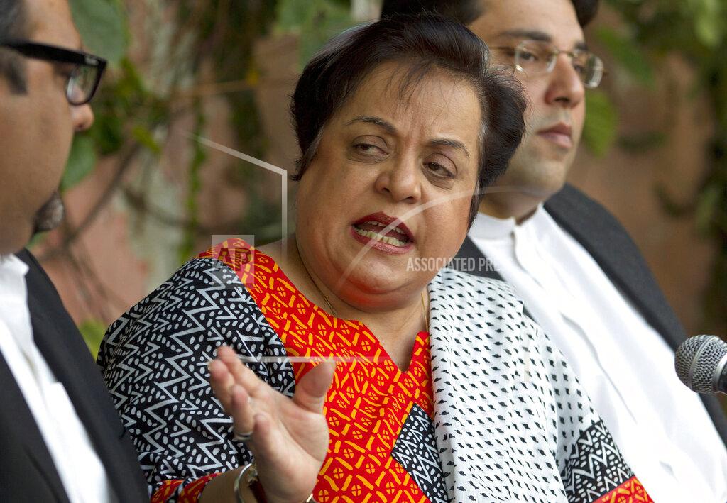 B.k Bangash FILE - In this Wednesday, Nov. 27, 2013 file photo, Shireen Mazari, center, leader of the Pakistan Tehreek-e-Insaf party, addresses a news conference with party officials, in Islamabad, Pakistan. The government's Human Rights Minister Mazari said in a series of tweets. "Journalists do their job & to target them, especially gender-based abusive attacks on women journos, is absolutely unacceptable and disgusting,". Social media attacks against Pakistan's women journalists have been vile and vicious, some threatening rape, others even threatening death and the culprits are most often allied to the ruling party, even prompting the Committee to Protect Journalists to issue a statement on Friday condemning the relentless attacks. (AP Photo/B.K. Bangash, File)