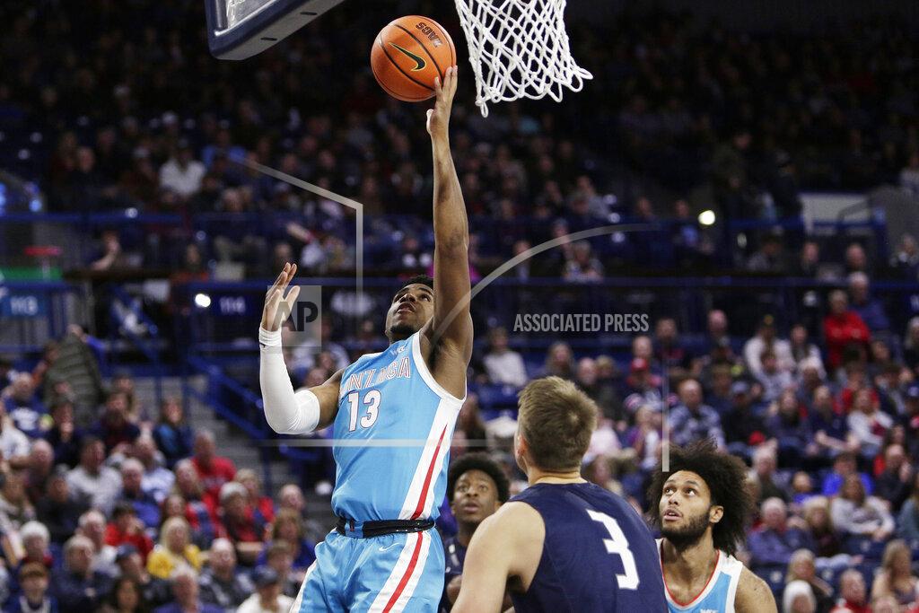 Young Kwak Gonzaga guard Malachi Smith (13) shoots in front of North Florida forward Carter Hendricksen (3) during the second half of an NCAA college basketball game, Monday, Nov. 7, 2022, in Spokane, Wash. Gonzaga won 104-63. (AP Photo/Young Kwak)