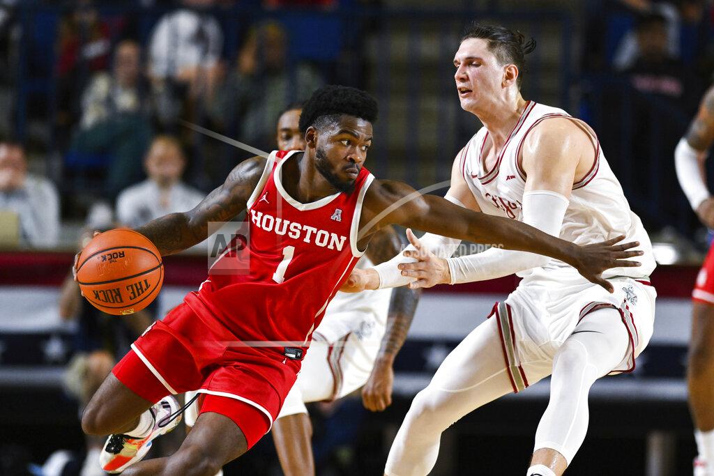 Terrance Williams Houston guard Jamal Shead (1) drives against Saint Joseph's forward Kacper Klaczek during the second half of an NCAA college basketball game at the Veterans Classic, Friday, Nov. 11, 2022, in Annapolis, Md. (AP Photo/Terrance Williams)