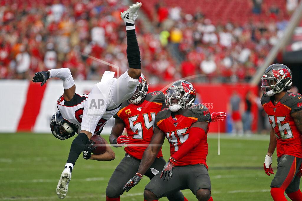 Mark Lomoglio Tampa Bay Buccaneers linebacker Devin White (45) and outside linebacker Lavonte David (54) send Atlanta Falcons wide receiver Russell Gage (83) flying after a reception during the first half of an NFL football game Sunday, Dec. 29, 2019, in Tampa, Fla. (AP Photo/Mark LoMoglio)