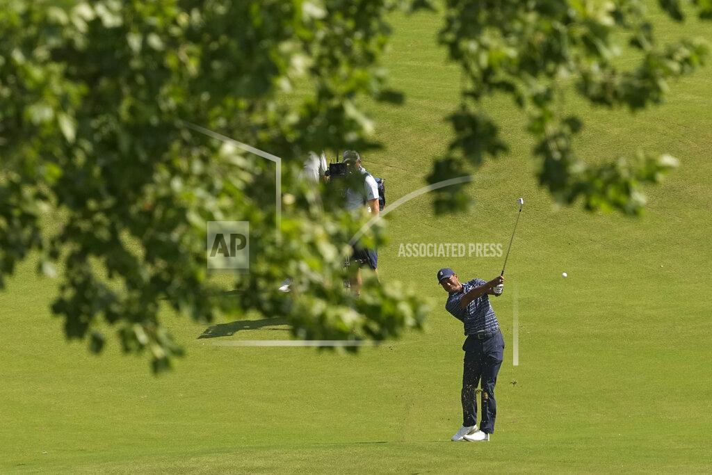 Matt York Tiger Woods hits from the fairway on the 18th hole during the first round of the PGA Championship golf tournament, Thursday, May 19, 2022, in Tulsa, Okla. (AP Photo/Matt York)