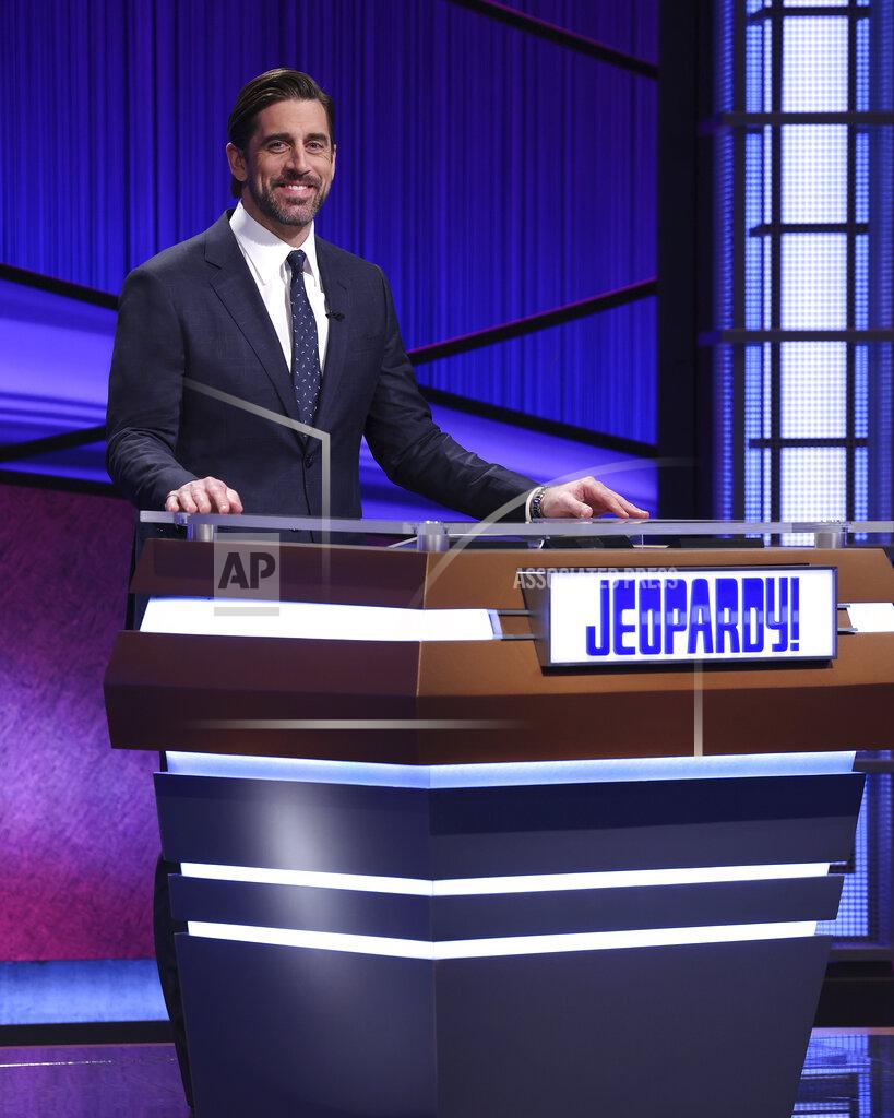 This image released by Jeopardy Productions, Inc. shows Green Bay Packers quarterback Aaron Rodgers as he guest hosts the game show "Jeopardy!" Rodgers is hosting the popular game show for the next two weeks as the show goes through a series of guest hosts to replace Alex Trebek, who died of cancer on Nov. 8. (Carol Kaelson/Jeopardy Productions, Inc. via AP)