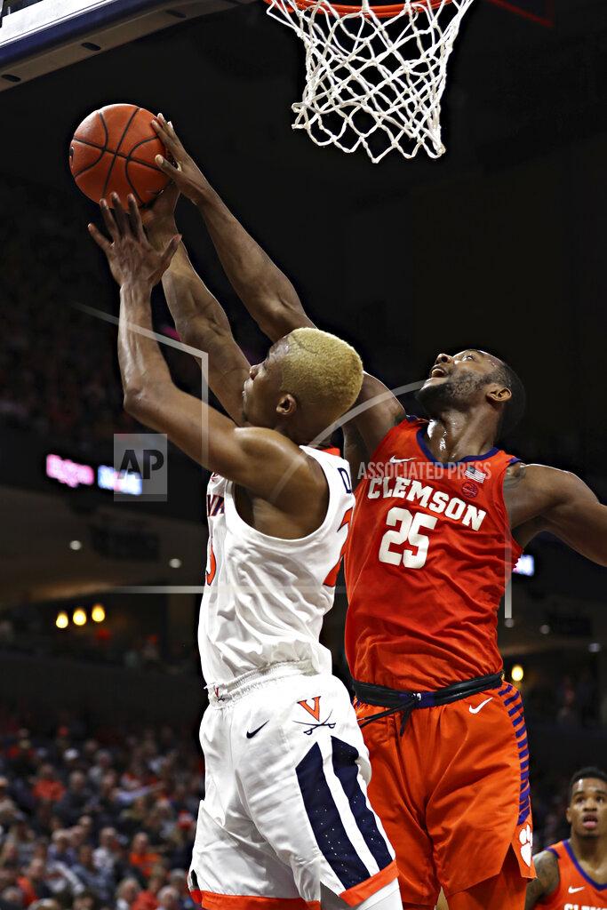 Erin Edgerton Clemson forward Aamir Simms (25) blocks a shot by Virginia forward Mamadi Diakite (25) during an NCAA college basketball game Wednesday, Feb. 5, 2020, in Charlottesville, Va. (Erin Edgerton/The Daily Progress via AP)