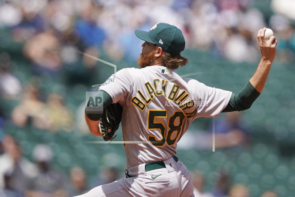 Ted S. Warren Oakland Athletics starting pitcher Paul Blackburn throws against the Seattle Mariners during the first inning of a baseball game, Wednesday, May 25, 2022, in Seattle. (AP Photo/Ted S. Warren)