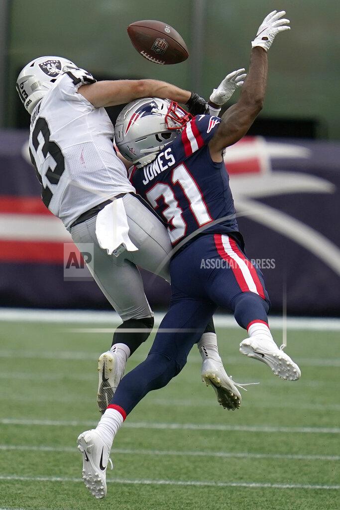 Charles Krupa New England Patriots defensive back Jonathan Jones (31) breaks up a pass intended for Las Vegas Raiders wide receiver Hunter Renfrow (13) in the second half of an NFL football game, Sunday, Sept. 27, 2020, in Foxborough, Mass. (AP Photo/Charles Krupa)