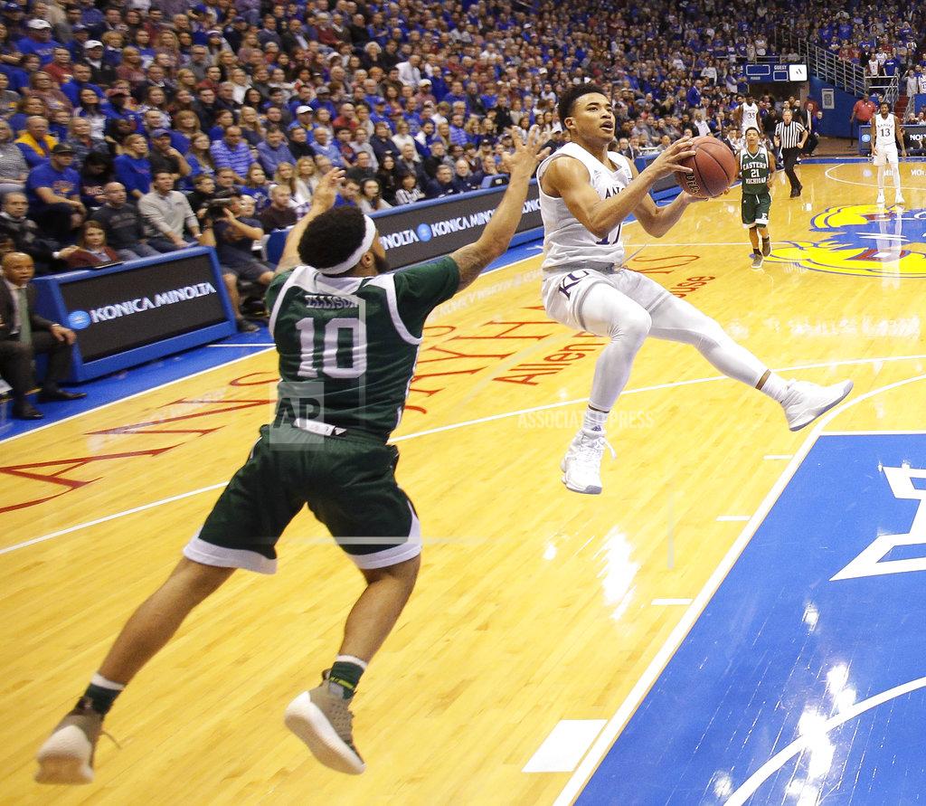 Charlie Riedel Kansas' Devon Dotson, right, shoots under pressure from Eastern Michigan's Malik Ellison (10) during the first half of an NCAA college basketball game Saturday, Dec. 29, 2018, in Lawrence, Kan. (AP Photo/Charlie Riedel)