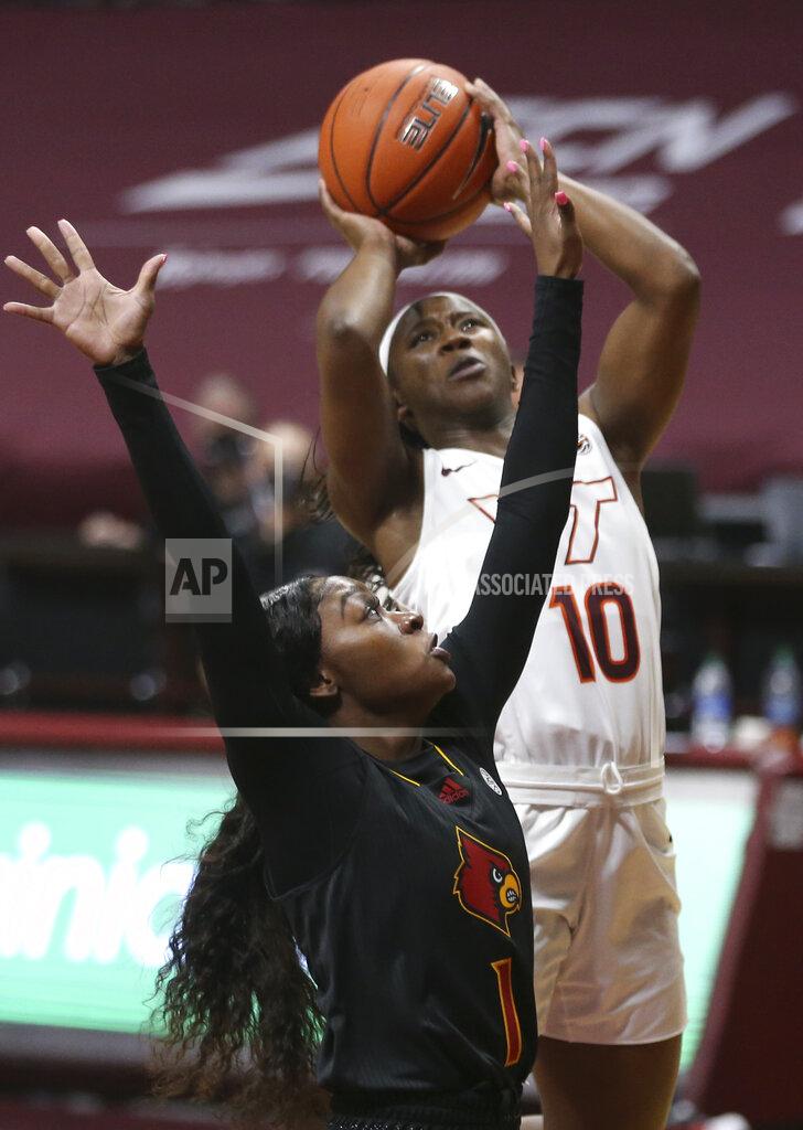 Matt Gentry Virginia Tech's Da'Ja Green shoots past Louisville's Dana Evans during the first half of an NCAA college basketball game Thursday, Jan. 7, 2021, in Blacksburg, Va. (Matt Gentry/The Roanoke Times via AP, Pool)