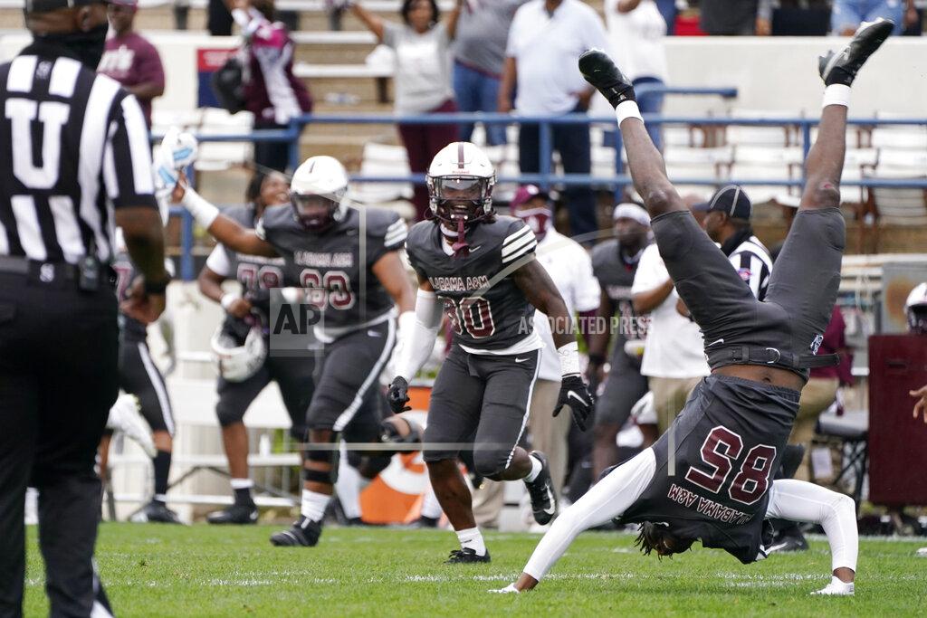 Rogelio V. Solis Alabama A&M wide receiver Abdul-Fatai Ibrahim (85) performs a celebratory handspring as the team celebrates a win over Arkansas-Pine Bluff in the Southwestern Athletic Conference championship NCAA college football game Saturday, May 1, 2021, in Jackson, Miss. Alabama A&M won 40-33. (AP Photo/Rogelio V. Solis)