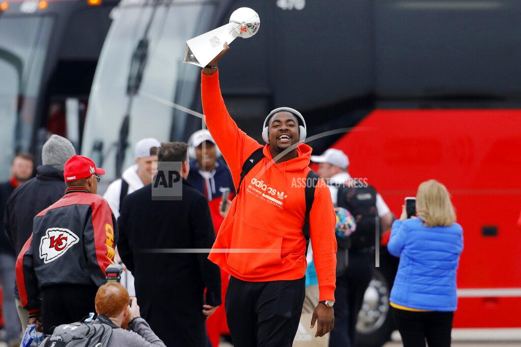 Colin E. Braley Kansas City Chiefs defensive tackle Chris Jones holds up the Vince Lombardi Trophy as he and his teammates return home a day after winning the NFL Super Bowl 54 football game Monday, Feb. 3, 2020, in Kansas City, Mo. The Chiefs defeated the San Francisco 49ers to win their first championship in 50 years. (AP Photo/Colin E. Braley)