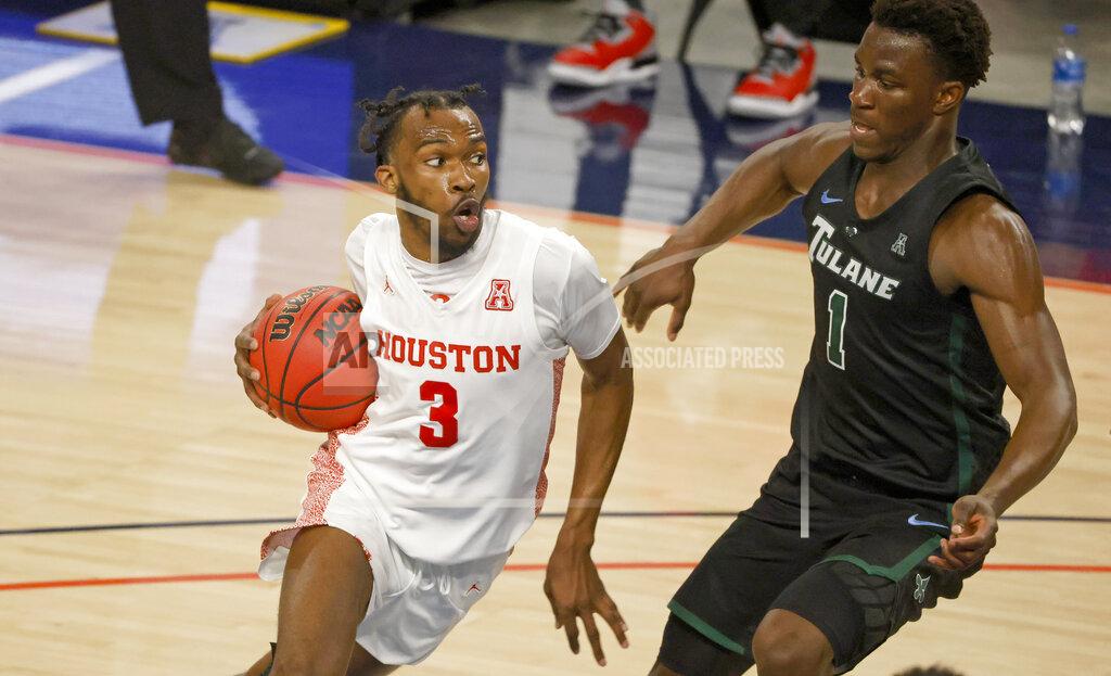 Ron Jenkins Houston guard DeJon Jarreau (3) drives past Tulane guard Sion James (1) during the second half of an NCAA college basketball game in the quarterfinals of the American Athletic Conference men's tournament Friday, March 12, 2021, in Fort Worth, Texas. (AP Photo/Ron Jenkins)
