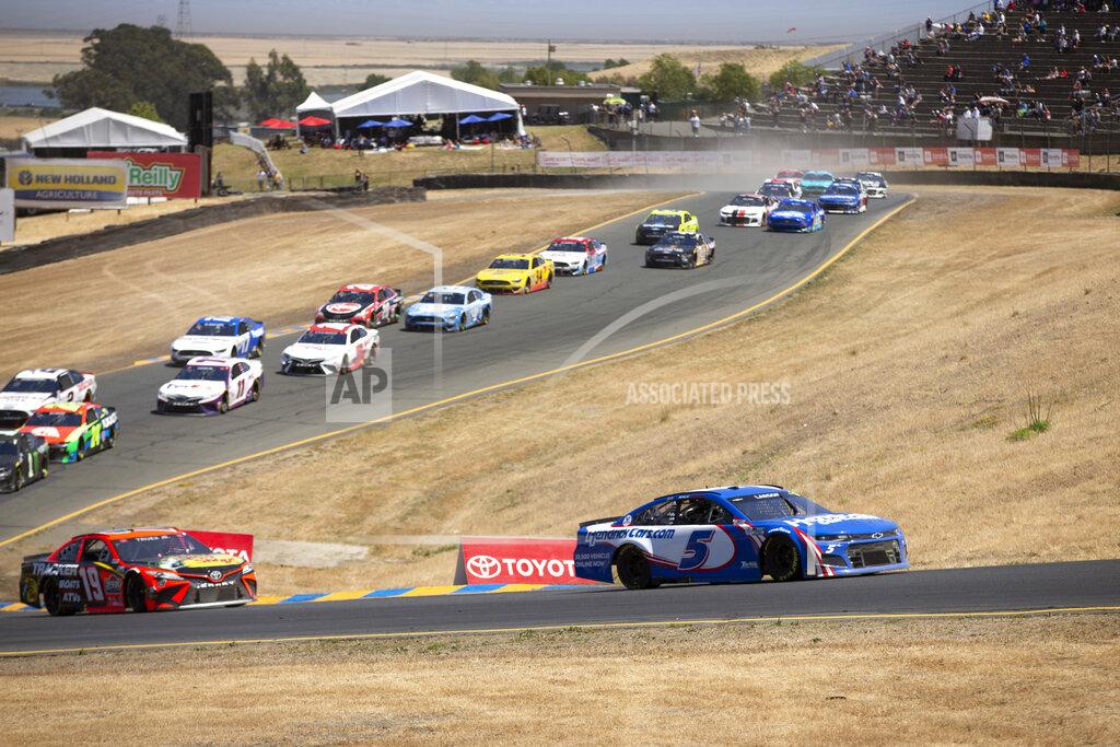 D. Ross Cameron Kyle Larson (5) leads the field during a NASCAR Cup Series race, Sunday, June 6, 2021, at Sonoma Raceway in Sonoma, Calif. (AP Photo/D. Ross Cameron)