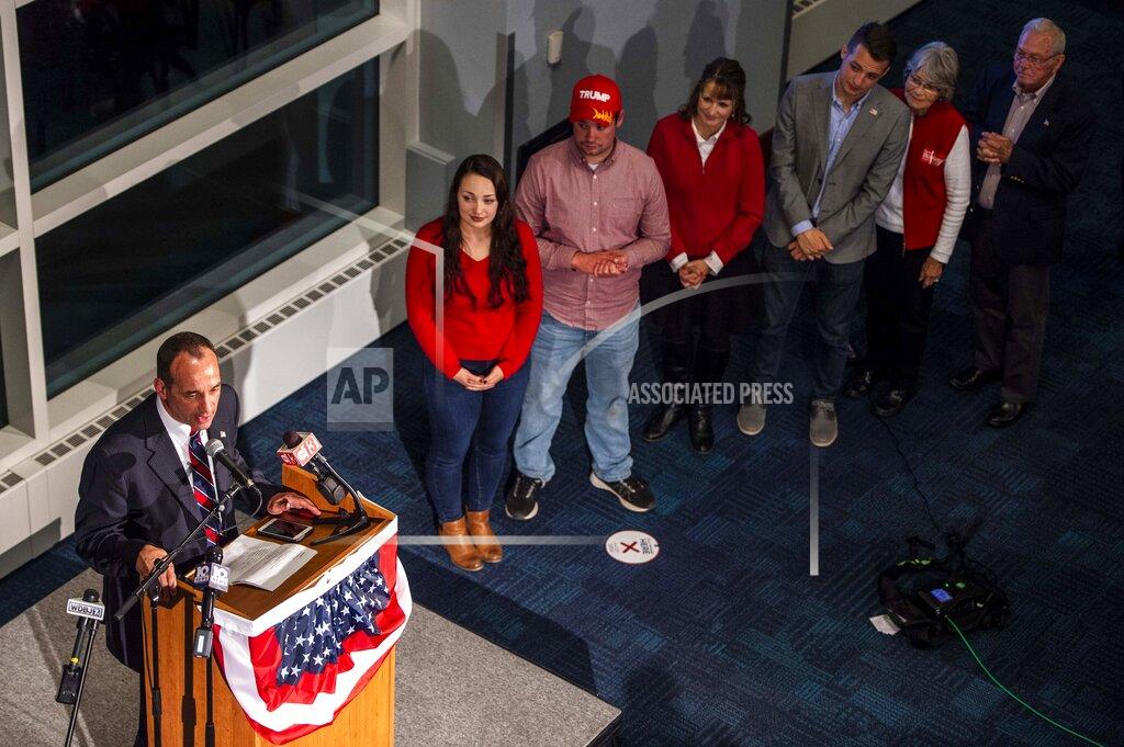 Kendall Warner Bob Good's family stands nearby as he speaks at Liberty University in Lynchburg, Va., Tuesday, Nov. 3, 2020. Good is running for the seat in the state's 5th Congressional District. (Kendall Warner/The News & Advance via AP)