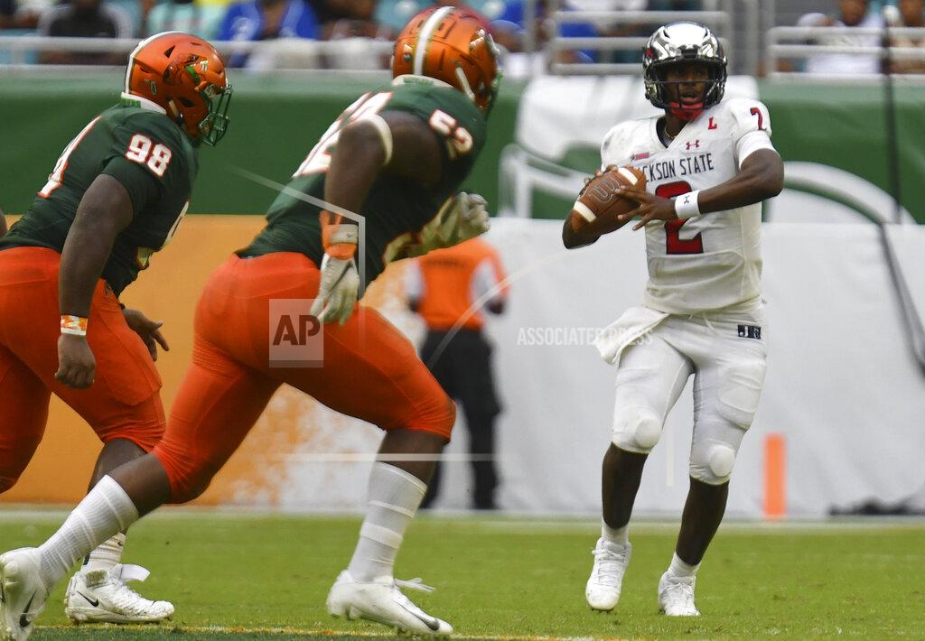 Jim Rassol Jackson State quarterback Shedeur Sanders (2) looks to pass downfield against Florida A&M in the fourth quarter of an NCAA college football game, Sunday, Sept. 5, 2021, in Miami Gardens, Fla. (AP Photo/Jim Rassol)