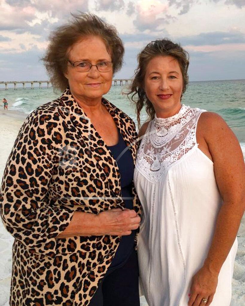 Uncredited This undated photo provided by Tisha Coleman shows her with her mother, Nina Worthington. Coleman fought to hold back tears while describing her 71-year-old mother, a former health care worker who was infected with the coronavirus. Worthington died Dec. 13, 2020. (Courtesy Tisha Coleman via AP)