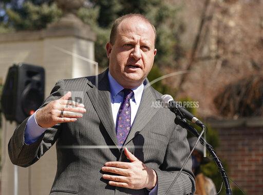FILE - In this March 10, 2021, file photo, Colorado Gov. Jared Polis speaks during a news conference outside the Governor's mansion in Denver. Colorado will include gender confirmation care in its individual and small group health insurance plans, state and federal officials announced Tuesday, Oct. 12, 2021. The state's plan under the Centers for Medicare & Medicaid Services will include jaw, cheek and eye modifications, face tightening, facial bone remodeling for facial feminization, breast or chest construction and reductions and laser hair removal. (AP Photo/David Zalubowski, File)