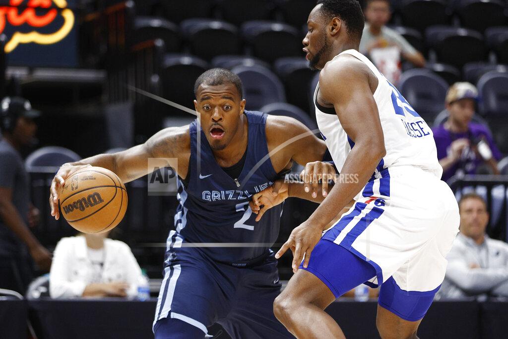 Jeff Swinger Memphis Grizzlies center Xavier Tillman (2) dribbles as Philadelphia 76ers forward Charles Bassey defends during the first quarter of an NBA summer league basketball game Tuesday, July 5, 2022, in Salt Lake City. (AP Photo/Jeff Swinger)