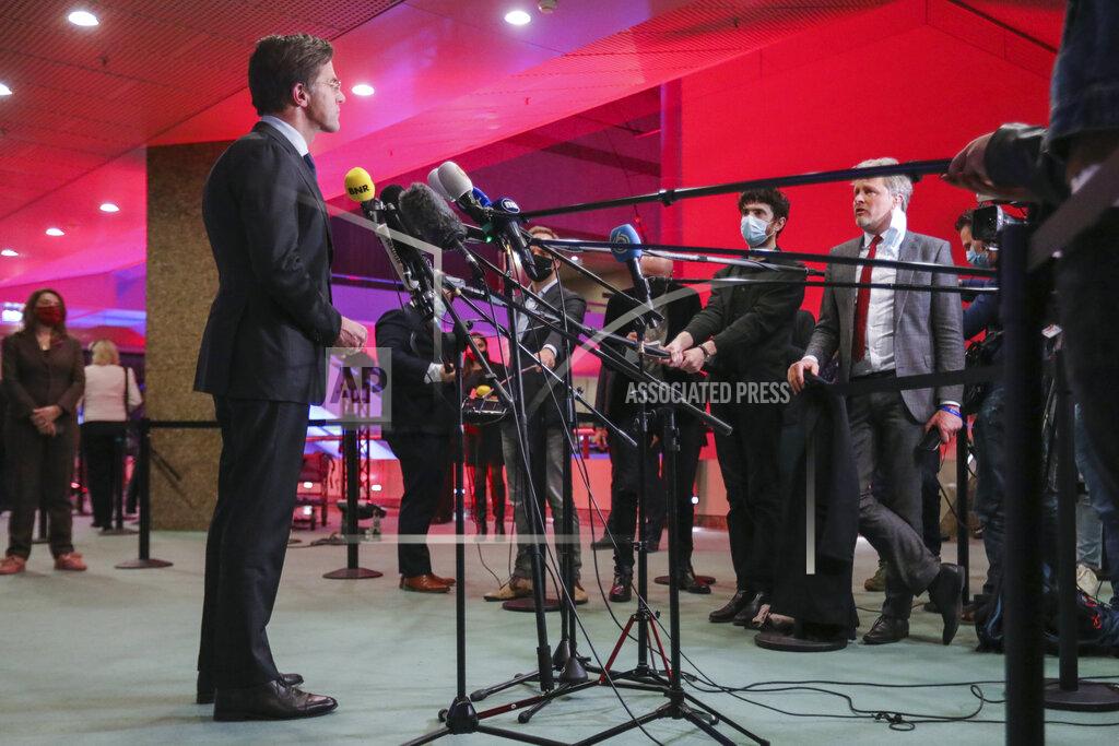 Eva Plevier Dutch caretaker Prime Minister Mark Rutte speaks with the media following exit polls in the general election in The Hague, Netherlands, March 17, 2021. Dutch voters pushed Rutte towards a fourth term in office in a general election Wednesday, bolstering his conservative party's position as the biggest in parliament and boosting a key ally into second place, an exit poll suggested. (Eva Plevier/Pool via AP)