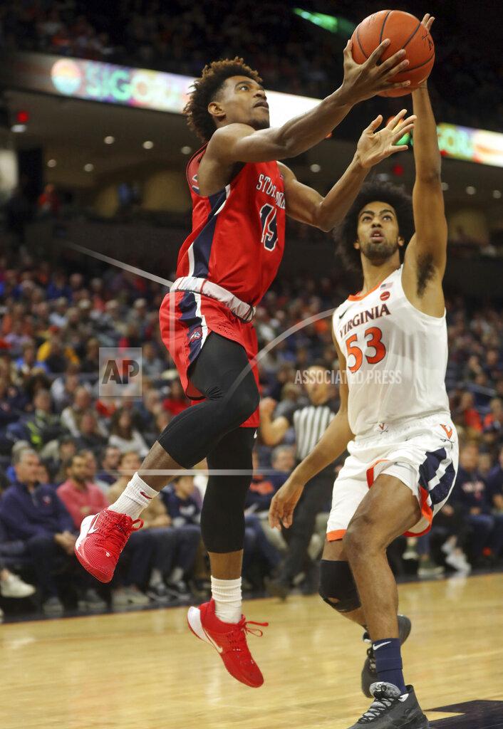 Andrew Shurtleff Stony Brook guard Tavin Pierre Philippe (15) shoots next to Virginia guard Tomas Woldetensae (53) during an NCAA college basketball game in Charlottesville, Va., Wednesday, Dec. 18, 2019. (AP Photo/Andrew Shurtleff)