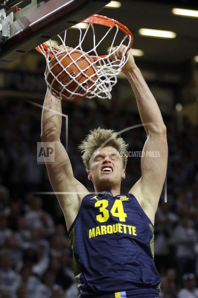 Orlin Wagner Marquette center Jayce Johnson dunks during the first half of the team's NCAA college basketball game against Kansas State in Manhattan, Kan., Saturday, Dec. 7, 2019. (AP Photo/Orlin Wagner)