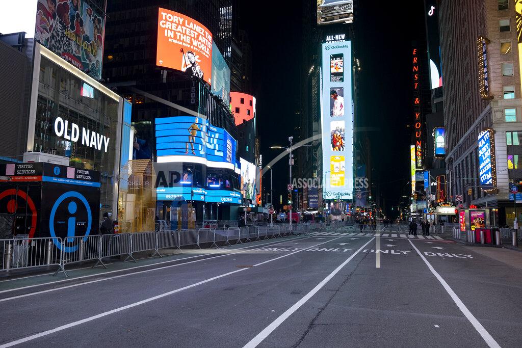 Craig Ruttle Seventh Avenue is mostly empty during what would normally be a Times Square packed with people, late Thursday, Dec. 31, 2020, in New York, as celebrations have been truncated this New Year's Eve due to the ongoing pandemic. (AP Photo/Craig Ruttle)