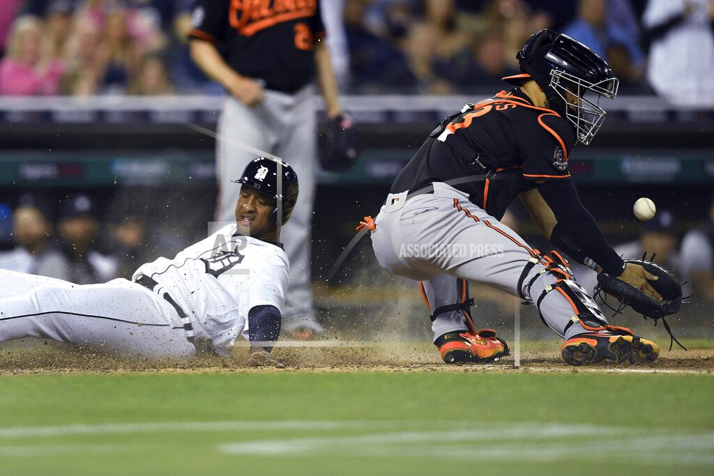 Jose Juarez Detroit Tigers' Jonathan Schoop, left, scores on a double by Willi Castro as Baltimore Orioles catcher Robinson Chirinos loses control of the ball during the sixth inning of a baseball game Friday, May 13, 2022, in Detroit. (AP Photo/Jose Juarez)